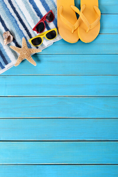 Summer beach background border, sunglasses, flip flops, starfish