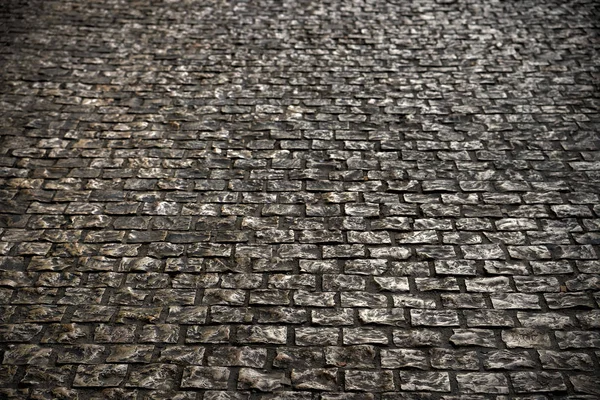 Vecchio ciottolo pietra strada superficie pavimentazione sfondo texture — Foto Stock