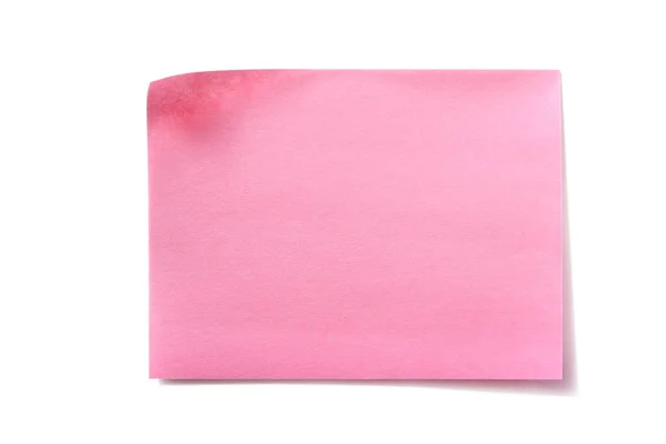 Um post pegajoso rosa nota isolado fundo branco — Fotografia de Stock