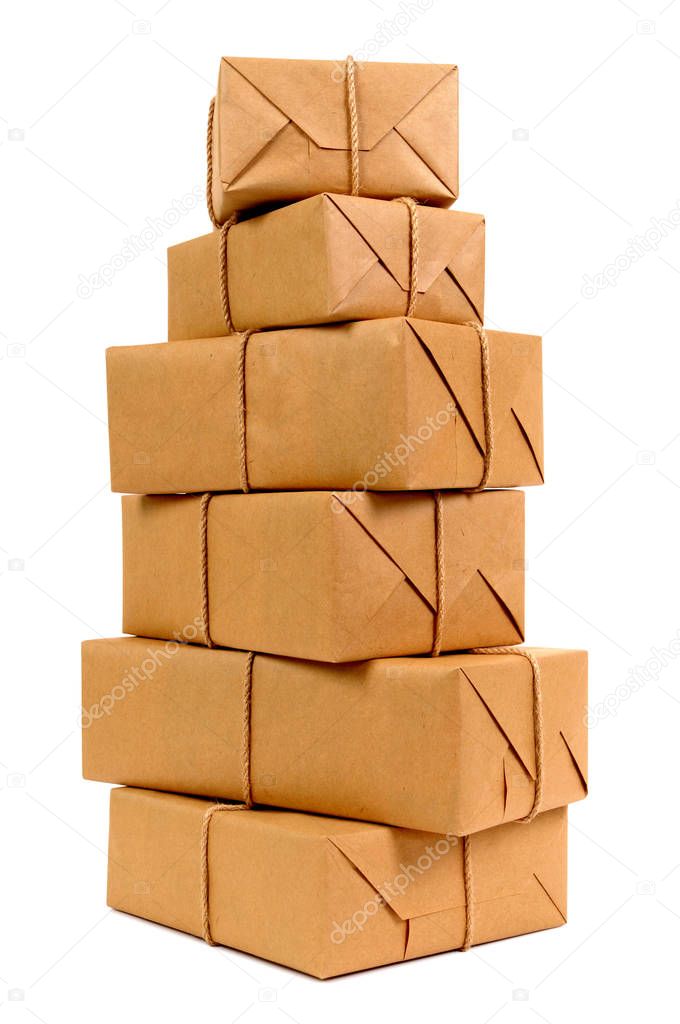 Tall stack of brown paper packages