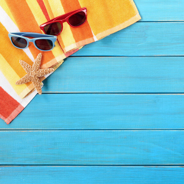 Summer beach background, sunglasses, starfish, copy space