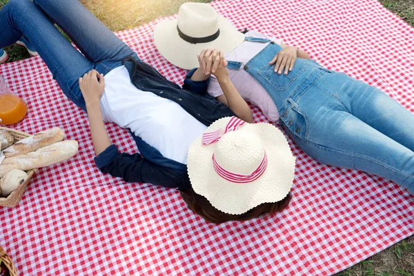 woman friend  lay on the picnic cloth