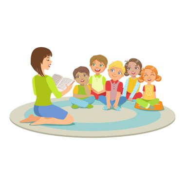 Küçük çocuklar yerdeki bir hikaye okuma öğretmen etrafında oturan grup