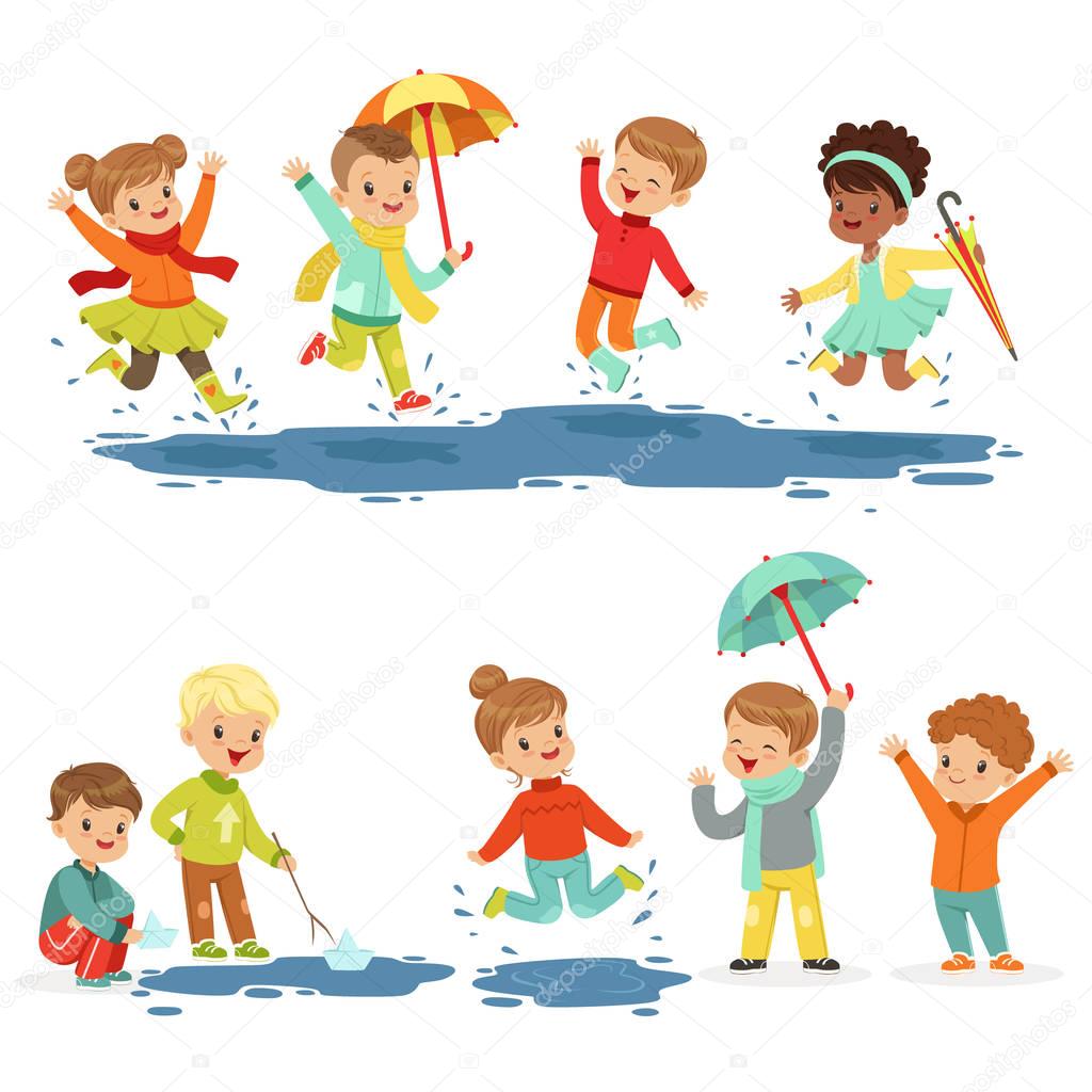 Cute smiling little kids playing on puddles, set for label design. Active leisure for children. Cartoon detailed colorful Illustrations