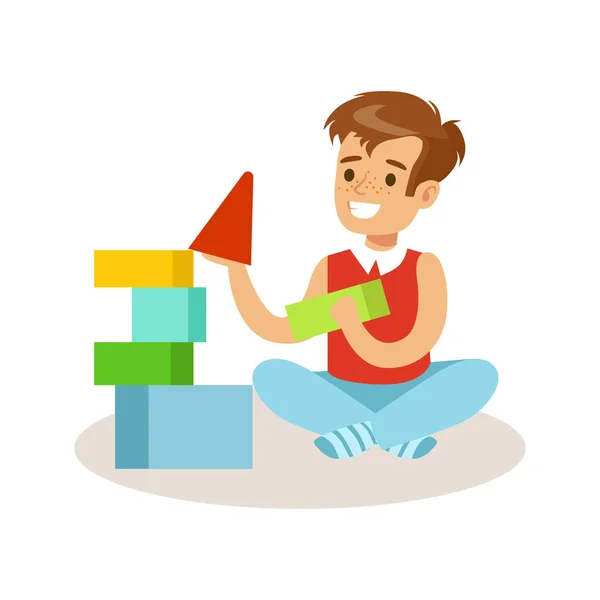 Niño feliz sentado y jugando con cubos de colores. Dibujos animados carácter vector Ilustración — Archivo Imágenes Vectoriales