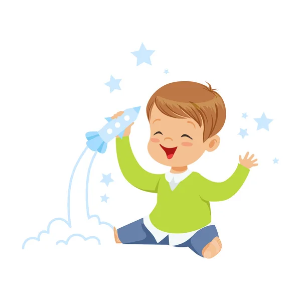 Lindo niño jugando con cohete juguete — Vector de stock