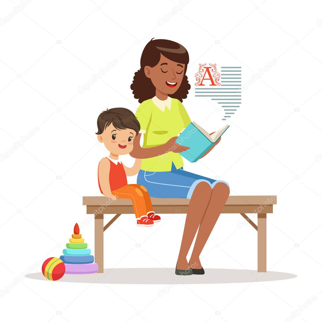 Teacher reading a book to little boy 