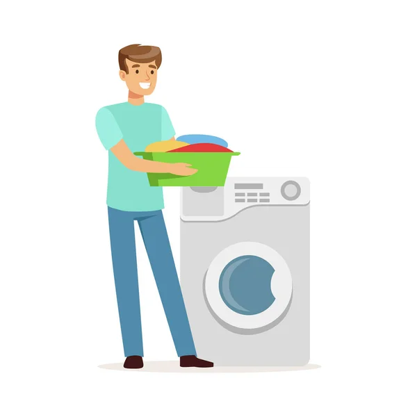 Young smiling man doing laundry, holding basin full of dirty laundry, house husband working at home vector Illustration — Stock Vector