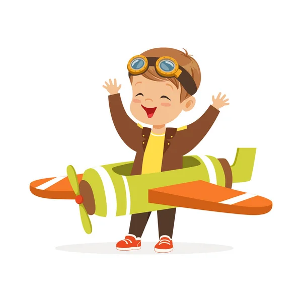 Schattige kleine jongen in piloot kostuum spelen speelgoed vliegtuig, kid droomt van het besturen van het vliegtuig vector illustratie — Stockvector