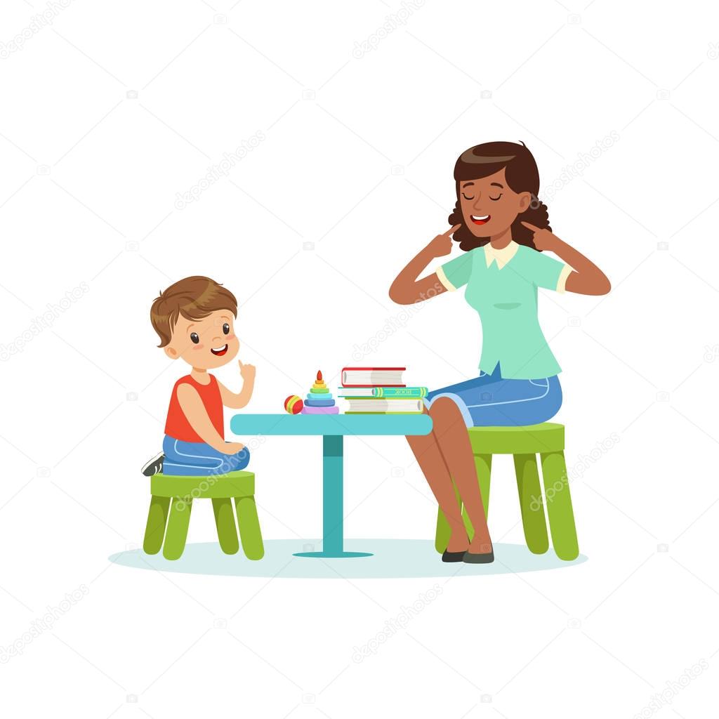 Professional speech therapy for preschool kid with therapist in kindergarten. Isolated flat vector