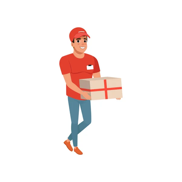 Delivery service worker with parcel in hands. Cartoon courier character in red t-shirt, cap and blue jeans. Cheerful young man carrying cardboard box. Flat vector design — Stock Vector