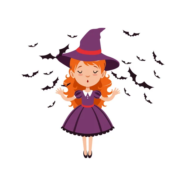 Young red-haired girl witch standing with hands up and wearing purple dress and hat. Kid character in Halloween costume surrounded with black bats. Flat cartoon vector — Illustration Young red-haired girl witch standing with hands up and wearing purple dress and hat. Kid character in Halloween costume surrounded with black bats. Flat cartoon vector — Stock Vector