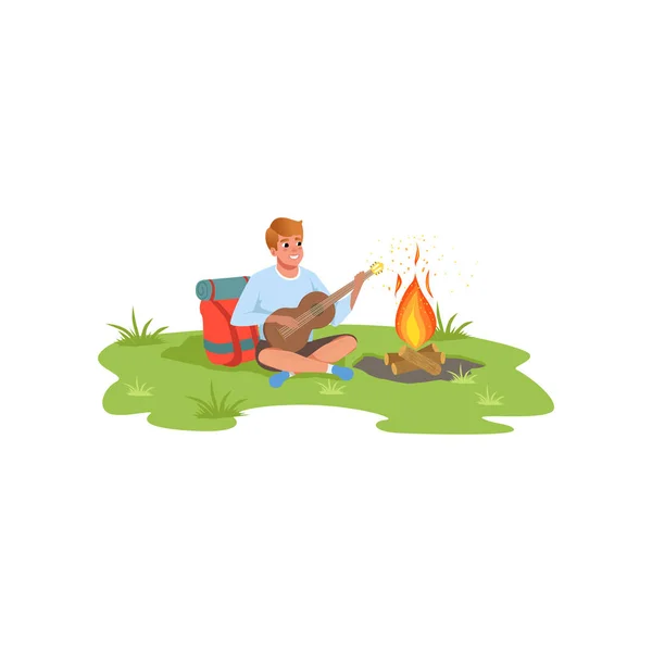 Young man playing guitar sitting next to bonfire, traveling, camping and relaxing concept, summer vacations vector Illustration on a white background — Stock Vector