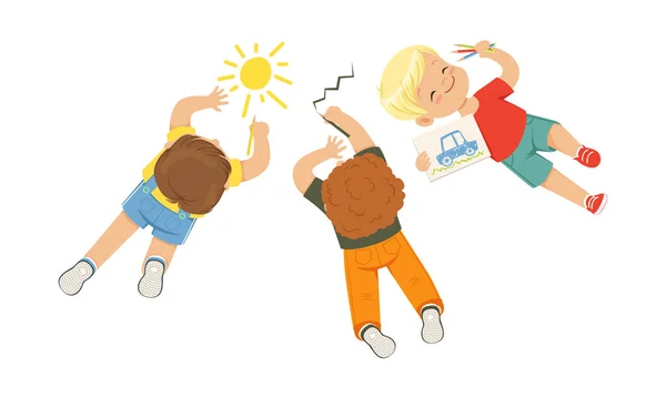 Cute Little Kids Lying on the Floor Drawing Pictures Vector Illustration — 图库矢量图片