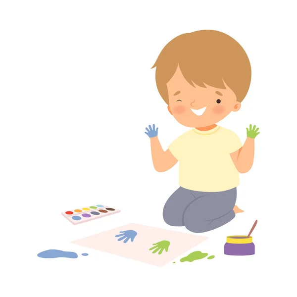 Cute Boy Sitting on the Floor Painting with Colorful Handprints, Adorable Young Artist Cartoon Character, Kids Creative Hobby Vector Illustration — Stock Vector