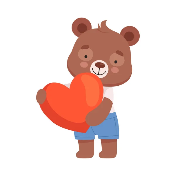 笑顔のクマのキャラクターが赤いハートを抱いています｜ベクトルイラスト — ストックベクタ
