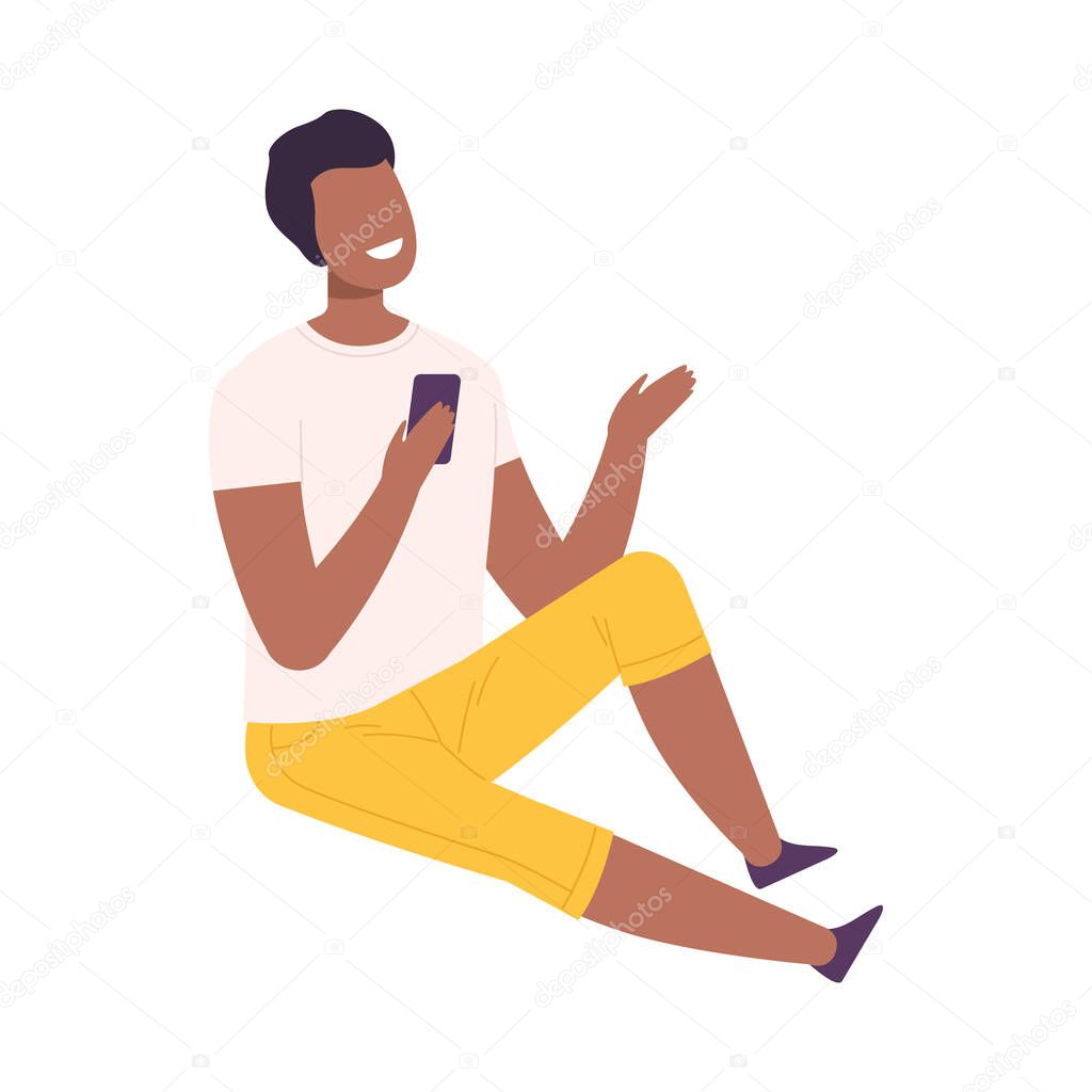 Smiling Young Man with Modern Digital Gadget, Guy Sitting on the Floor and Communicating Using His Smartphone Flat Vector Illustration