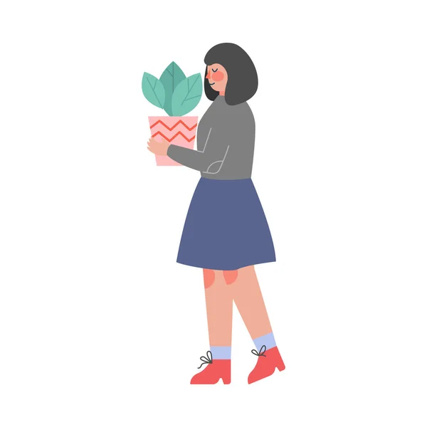 Žena nesoucí květináč se zelenou rostlinou, dívka pečující o rostliny v domácnosti nebo stěhující se do jiného domova vektorové ilustrace — Stockový vektor