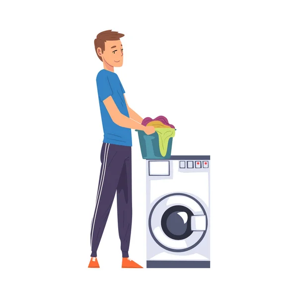 Hombre sosteniendo cesta de lavandería mientras está de pie al lado de la lavadora, la actividad del hogar, la limpieza, los deberes cotidianos y las tareas ilustración vectorial de dibujos animados — Vector de stock