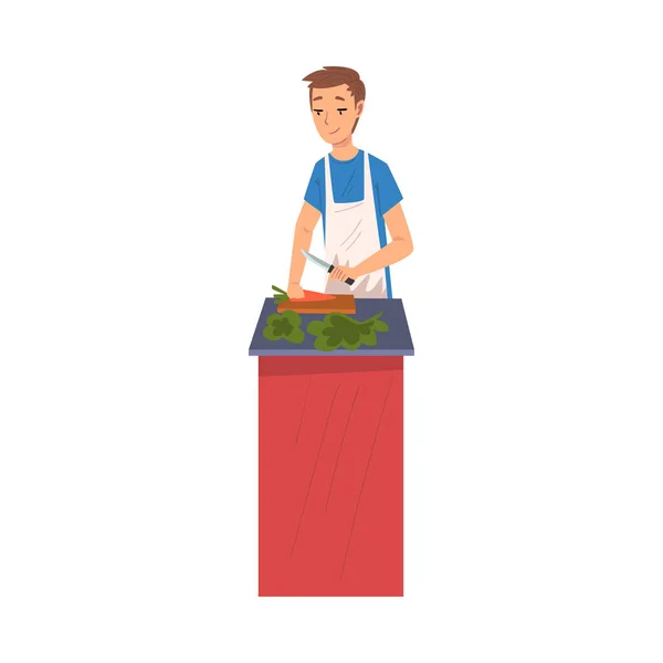 Young Man Cooking Salad in the Kitchen, Household Activity, Housekeeping, Everyday Duties and Chores Cartoon Vector Illustration — Stock Vector