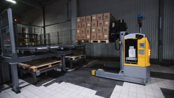 Camera cranes up on shelves of cardboard boxes inside a storage warehouse. — Stock Video