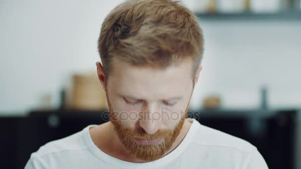 Crying tears in eyes of depressed ginger man — Stock Video