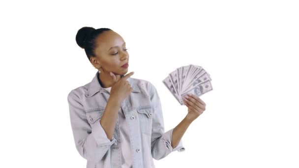 Thoughtful successful african american woman with money on white background Jean jacket — Stock Video