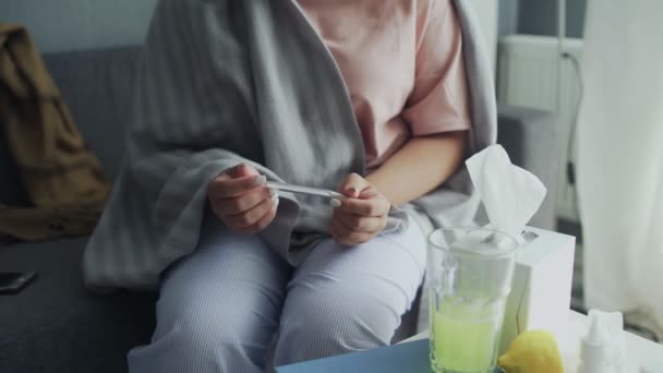 Ill young black woman with cold checking temperature with thermometer — Stock Video