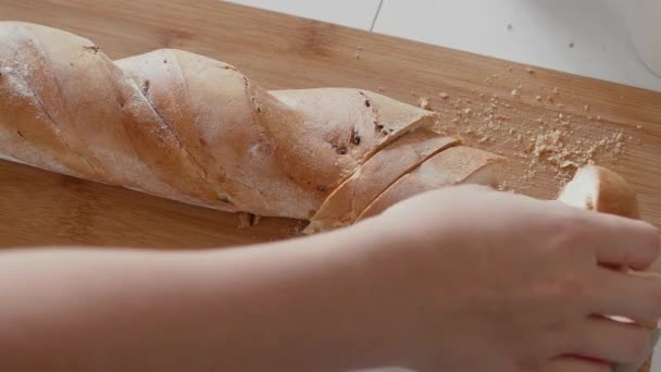 Close up of Young woman eats cutted bread and drinks milk — Stock Video