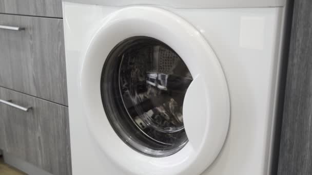 Close up of female hand opens washing machine — Stock Video