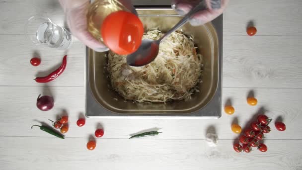 Top view of chef cooks salted cabbage with carrots — Stock Footage Top view of chef cooks salted cabbage with carrots Royalty Free Stock Footage
