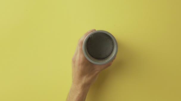 Man puts Color pencils to cup — Stock Video