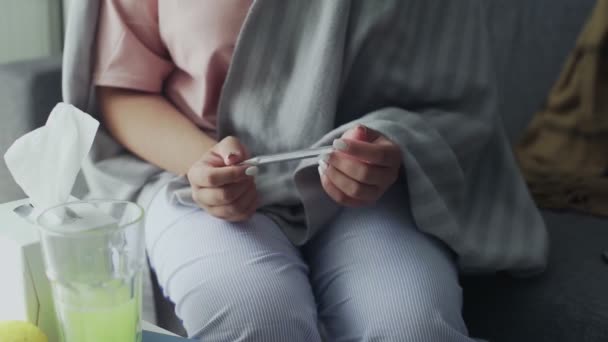 Ill young black woman with cold checking temperature with thermometer — Stock Video