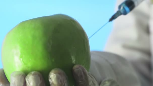 Scientist Injecting Apple with Chemical Solution for Experiment. Corona. Covid-19 — Stock Video