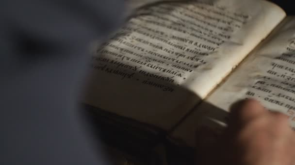 Back view of Someone is leafing through old book — Stock Video