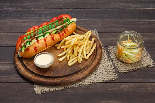 American food - classic hot dog with potato fries chips