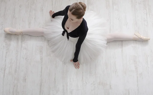 Classical Ballet dancer in split portrait, top view