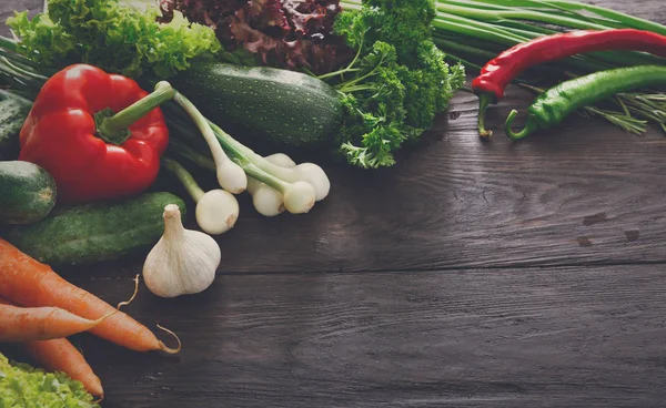 Border of fresh vegetables on wooden background with copy space — Stock Photo, Image
