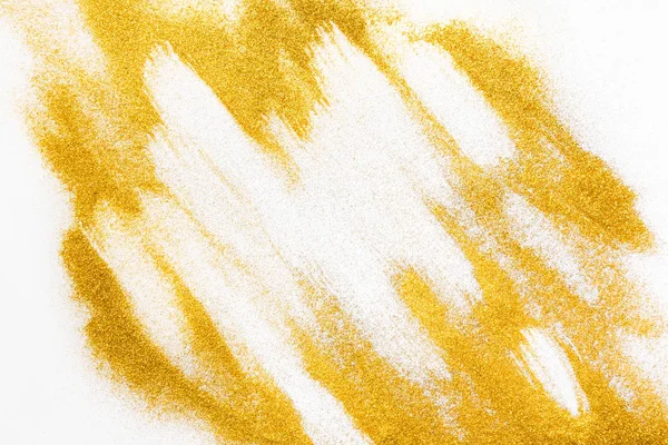 Golden glitter sand texture on white, abstract background. — Stock Photo, Image