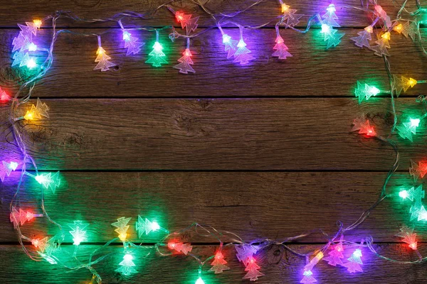 Boże Narodzenie światła granicy na tle drewna — Zdjęcie stockowe