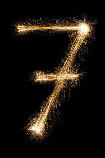 Nuovo anno font sparkler numero sette su sfondo nero — Foto Stock