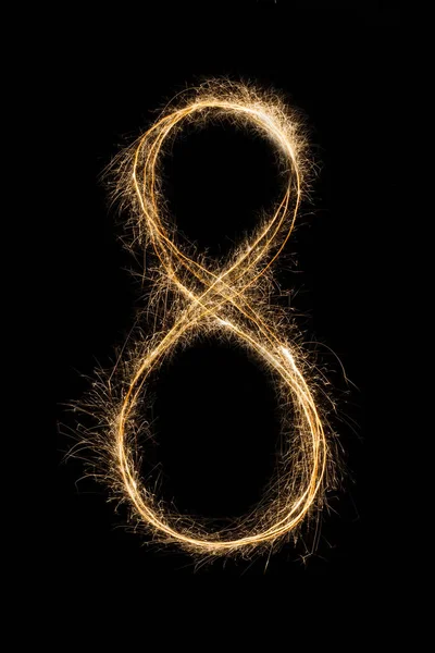 New year font sparkler number eight on black background — Stock Photo, Image