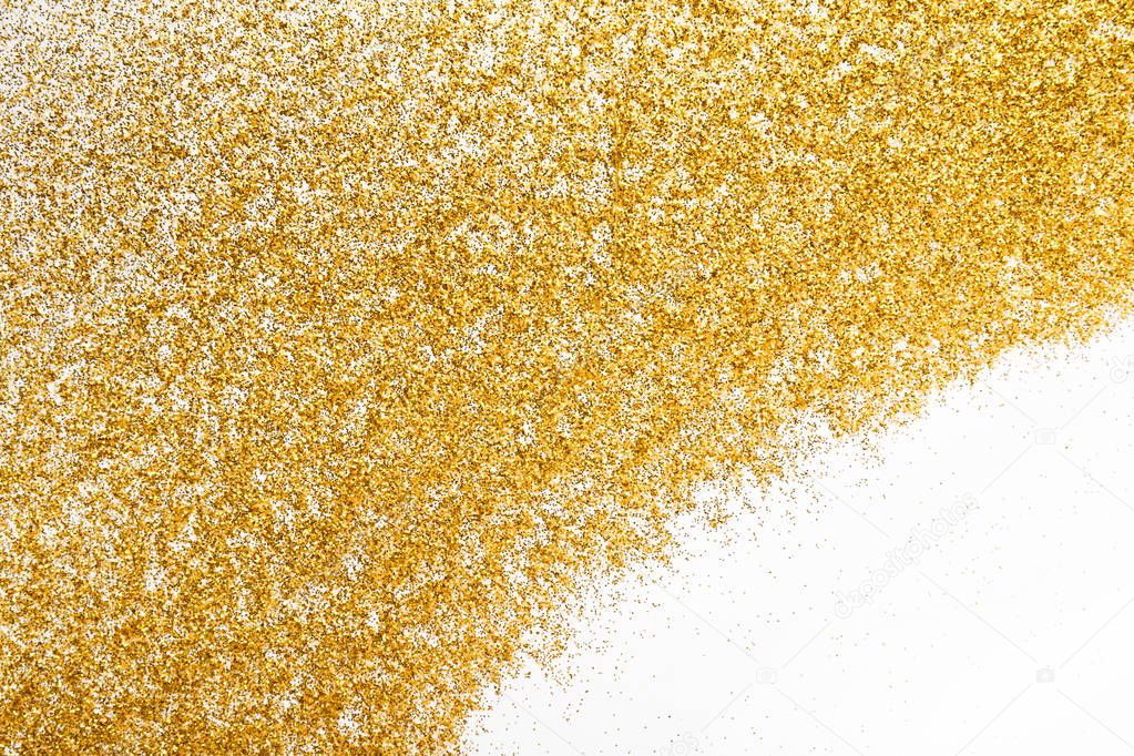 Golden glitter sand texture frame on white, abstract background.