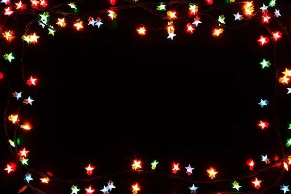 Noël lumières bordure sur fond noir — Photo