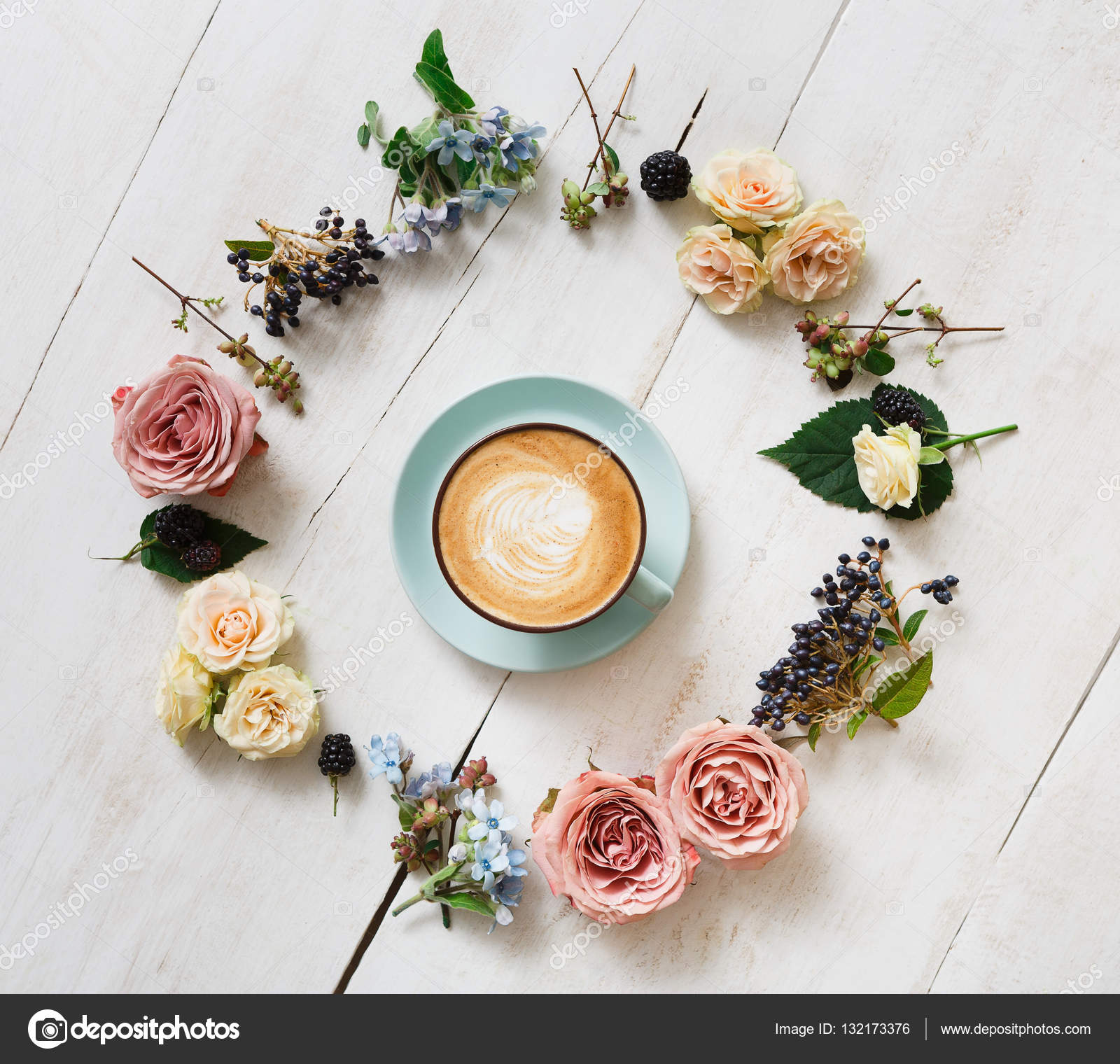 Cappuccino coffee and flowers composition on white wood — Stock Photo