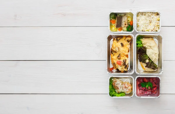 Healthy food take away in boxes, top view at wood — Stock Photo, Image