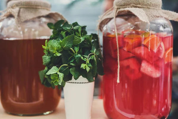 Closeup of lemonades in glass jars at restaurant background — Stock Photo, Image