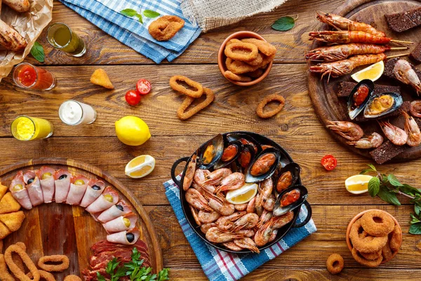 Seafood platter top view, flat lay on wooden table background