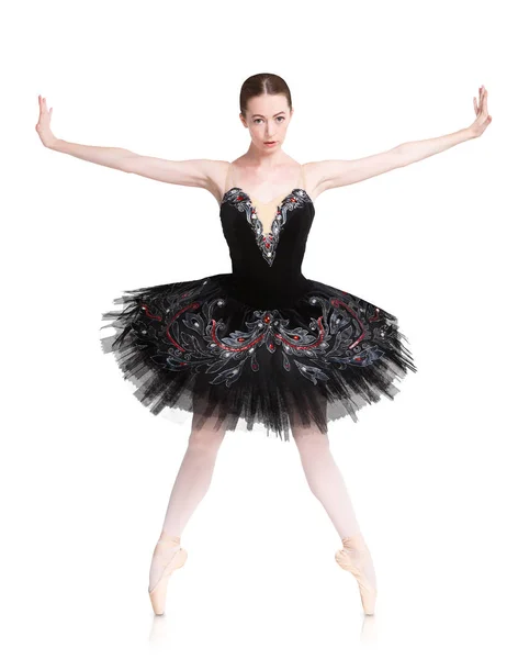 Beautiful ballerine stands in releve ballet position — Stock fotografie