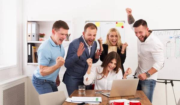 Happy business people team celebrate success in the office